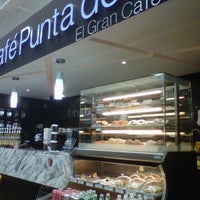 Photo taken at Café Punta del Cielo by yVero M. on 10/29/2011