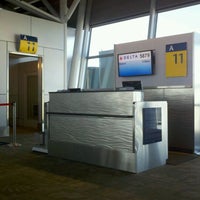Photo taken at Gate A11 by Travis G. on 2/6/2012