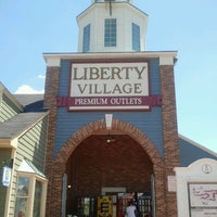 Photo taken at Liberty Village Outlet Marketplace by Allah A. on 6/23/2012