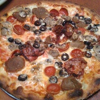 Photo taken at Amici&amp;#39;s East Coast Pizzeria by Alvin A. on 11/16/2011