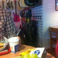 Photo taken at Tommy&amp;#39;s Guitars and Café by FLee Q. on 3/24/2012