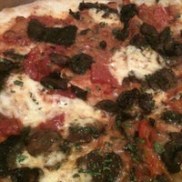Photo taken at Stone Hearth Pizza by Sujei L. on 3/1/2012
