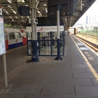 Photo taken at Queens Park London Underground Station by Chris B. on 7/25/2012