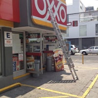 Photo taken at Oxxo by Mike Z. on 4/21/2012