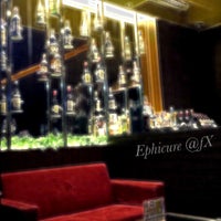 Photo taken at Ephicure Wine Lounge by Ifan H. on 4/8/2012