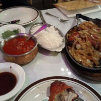 Photo taken at Madhu Cuisine of India by Zach Z. on 4/27/2012