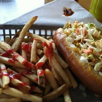 Photo taken at The Slaw Dogs at the Village by Baum on 4/26/2012