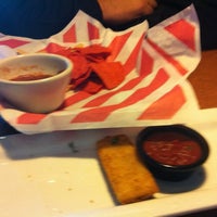 Photo taken at TGI Fridays by A H. on 10/28/2011
