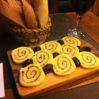Photo taken at Di Vino Vinoteca Cafe Bar by Kristina S. on 4/7/2012