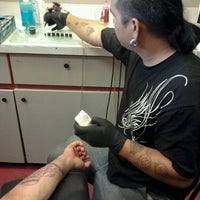 Photo taken at Hollywood Stars Tattoo by Paul L. on 2/25/2012