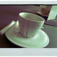 Photo taken at Cafea de Lux by M A. on 3/8/2012