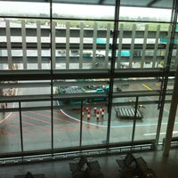 Photo taken at Gate 411 by Alessandro B. on 3/16/2012