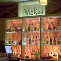Photo taken at Wicked Restaurant and Wine Bar by Alexandra on 2/24/2011