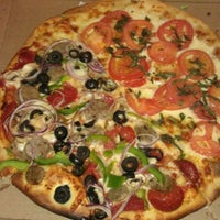 Photo taken at Nicky D&amp;#39;s Wood Fired Pizza by Veronica G. on 4/22/2012