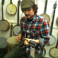 Photo taken at Mandolin Brothers by Kate R. on 12/17/2011