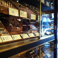 Photo taken at Revolucion Cigars and Gifts by Agnès T. on 3/15/2012