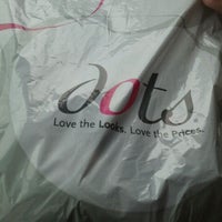 Photo taken at Dots Fashions by Brook O. on 10/13/2011