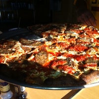 Photo taken at Tucci&amp;#39;s Fire N Coal Pizza by Christopher H. on 4/9/2011