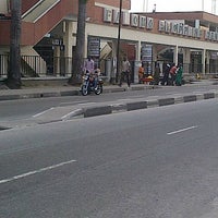 Photo taken at Falomo Shopping Centre by Tope A. on 7/21/2012