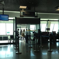 Photo taken at Gate 1 by Gabriela M. on 6/7/2012