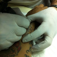Photo taken at Aof Tattoo Studio by kla C. on 3/14/2012