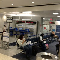Photo taken at Gate E8 by Booker D. on 4/1/2012