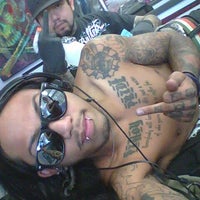 Photo taken at Horns and Halos Tattoo by Camel V. on 10/8/2011