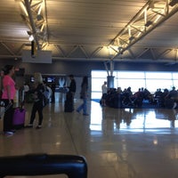 Photo taken at Gate 34 by Lauren D. on 6/15/2012
