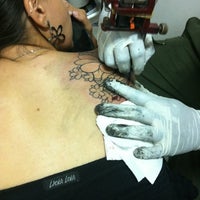 Photo taken at Candle Tattoo by Mariana B. on 3/3/2012