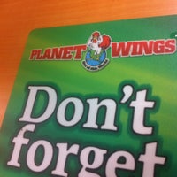 Photo taken at Planet Wings by Tahisha S. on 7/11/2012