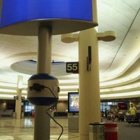 Photo taken at Gate 55 by Drew B. on 7/20/2012