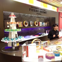 Photo taken at Pierre Hermé - Galeries Lafayette by Tony M. on 12/17/2011