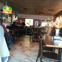 Photo taken at G&amp;#39;s Pizzeria and Deli by Bradley M. on 12/30/2011