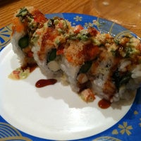 Photo taken at Sushi Train by Julie YouGyoung P. on 12/28/2011