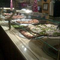 Photo taken at La Nonna Pizzeria Trattoria Paninoteca by Polly C. on 12/28/2011