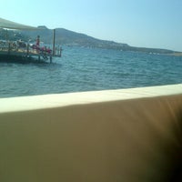 Photo taken at Mono Beach by Engin A. on 8/8/2012