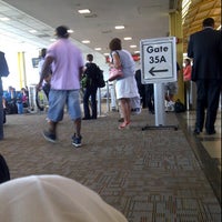 Photo taken at Gate D35 by Brian R. on 6/8/2012