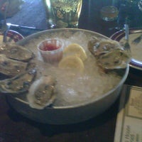 Photo taken at Molly Cool&#39;s Seafood Tavern by Katie S. on 10/21/2011