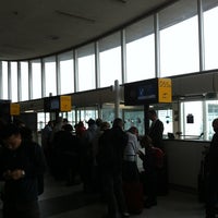 Photo taken at Gate D55 by Christophe M. on 10/29/2011