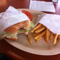 Photo taken at Olympian Burgers by Adrian M. on 4/24/2012