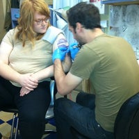 Photo taken at West Town Tattoo by Maureen on 9/22/2011