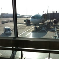 Photo taken at Gate 411 by Kevin S. on 3/25/2012