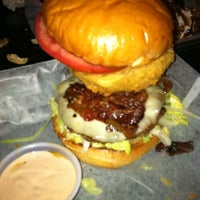 Photo taken at Mojo&amp;#39;s Famous Burgers Cherrydale by Kimberly H. on 3/8/2011