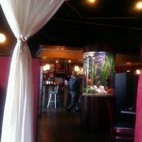 Photo taken at Nikko Sushi + Sake Lounge by Anna J. on 4/5/2012