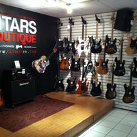 Photo taken at Guitars Boutique by Yaritza R. on 3/17/2012