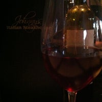 Photo taken at Johnny&amp;#39;s Italian Steakhouse by Pamela S. on 8/26/2012