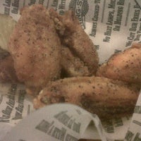 Photo taken at Wingstop by Sonya S. on 12/17/2011