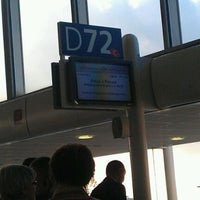 Photo taken at Gate D72 by Gregory K. on 10/13/2011