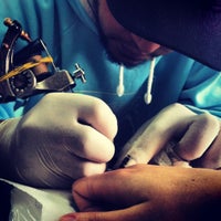 Photo taken at John Tattoo by Fernanda G. on 7/1/2012