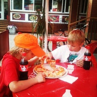 Photo taken at Gustosa Pizza by Андрей К. on 7/26/2012